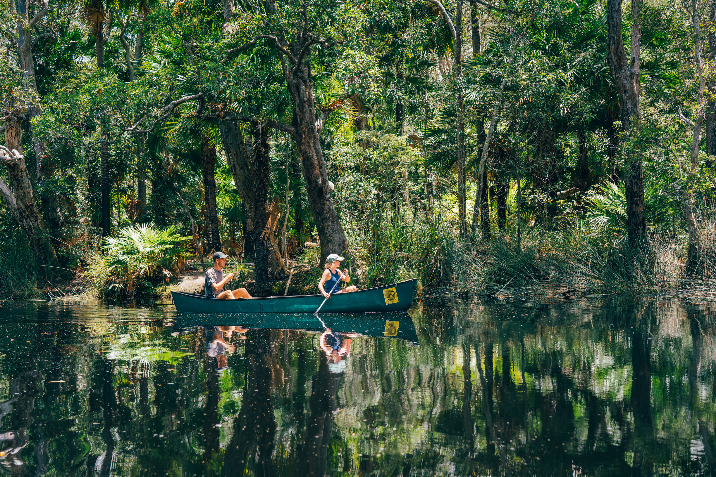 A couple kayaking through the Noosa Everglades A couple kayaking through the Noosa Everglades